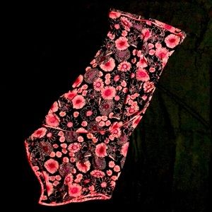 Small strapless asymmetrical flower print dress.